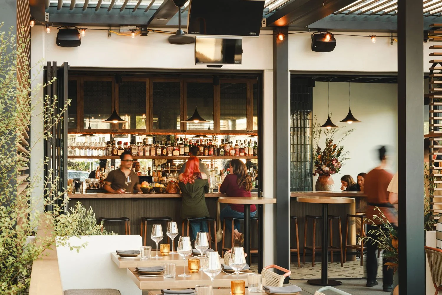 People sitting at the bar at Marlena restaurant