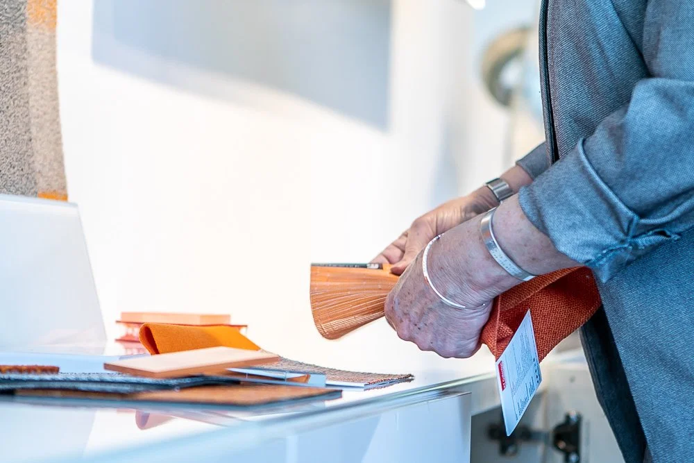 Hands holding fabric swatches