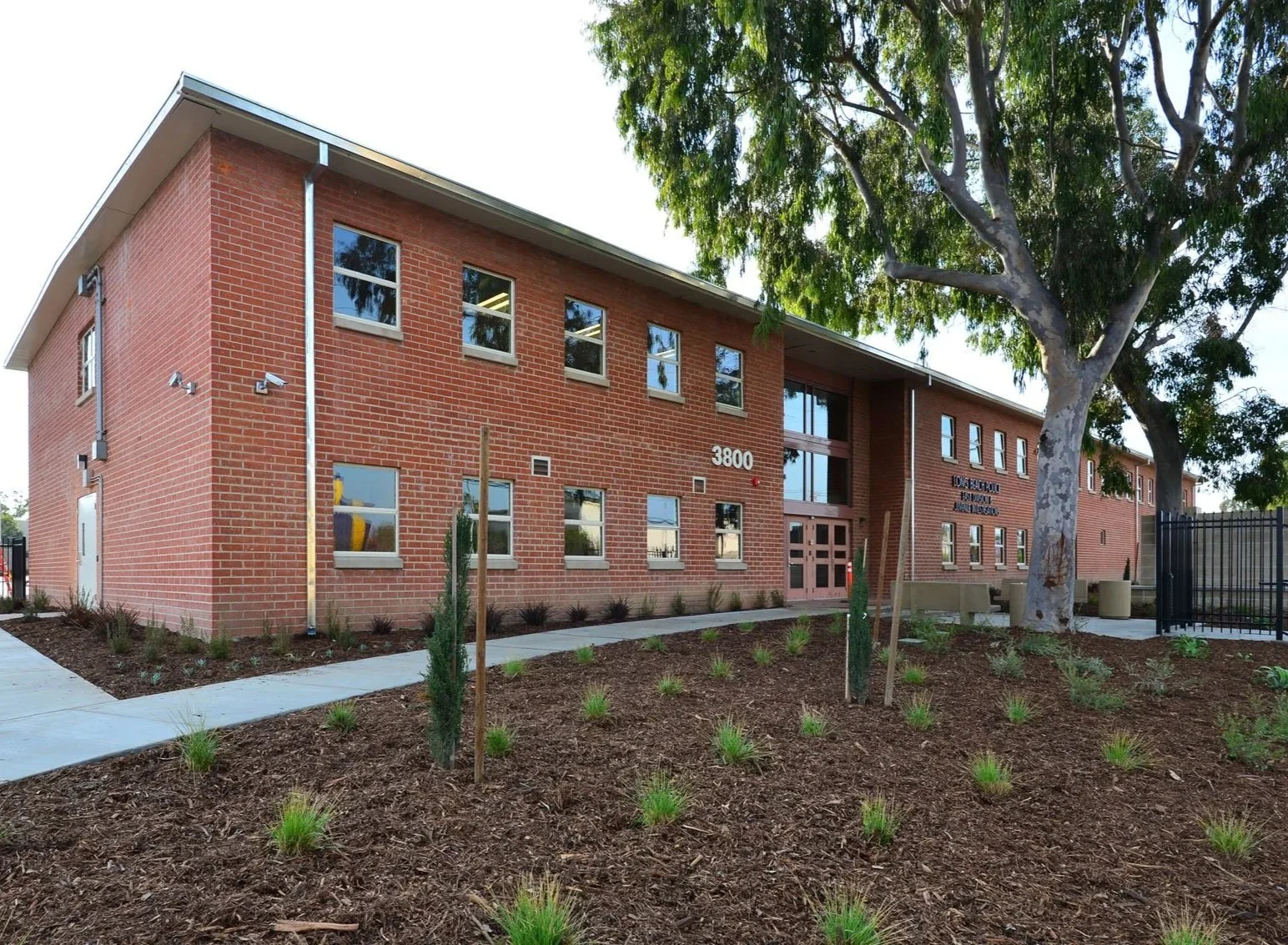 Exterior view of a brick building with new landscaping