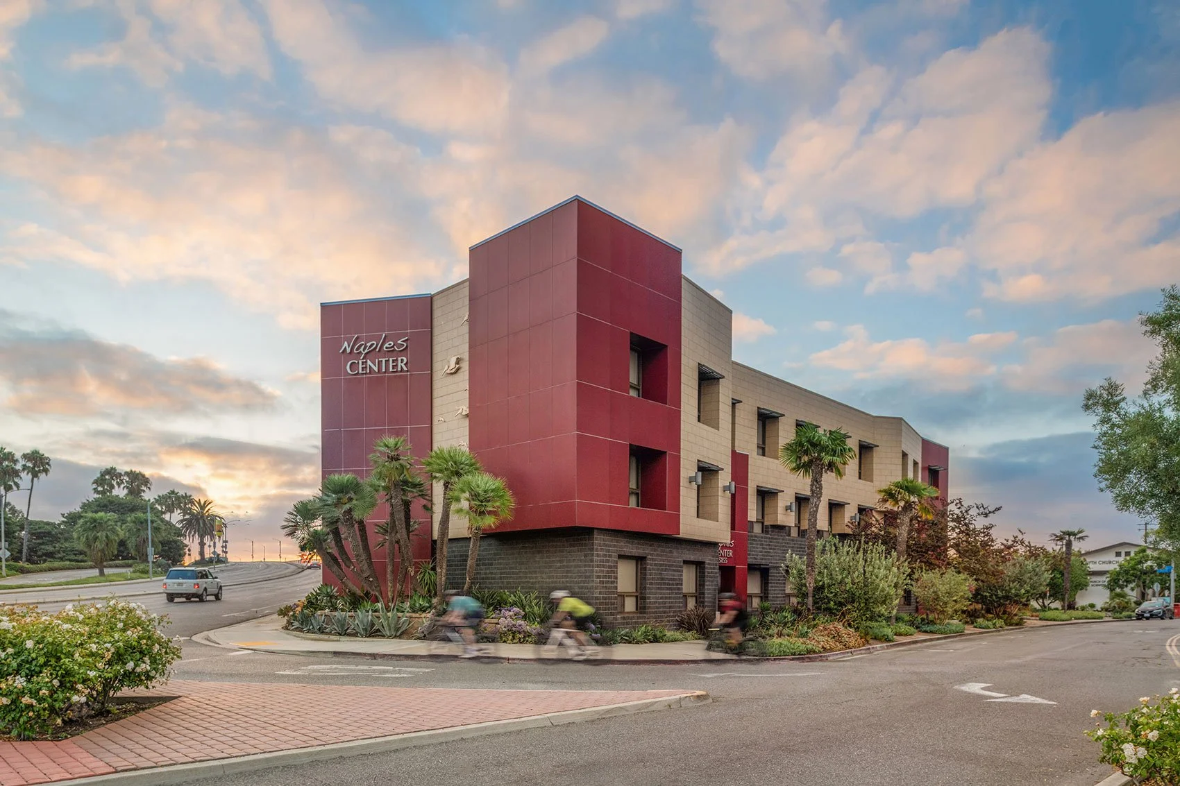 Exterior of Naples Center with a bicycle riders