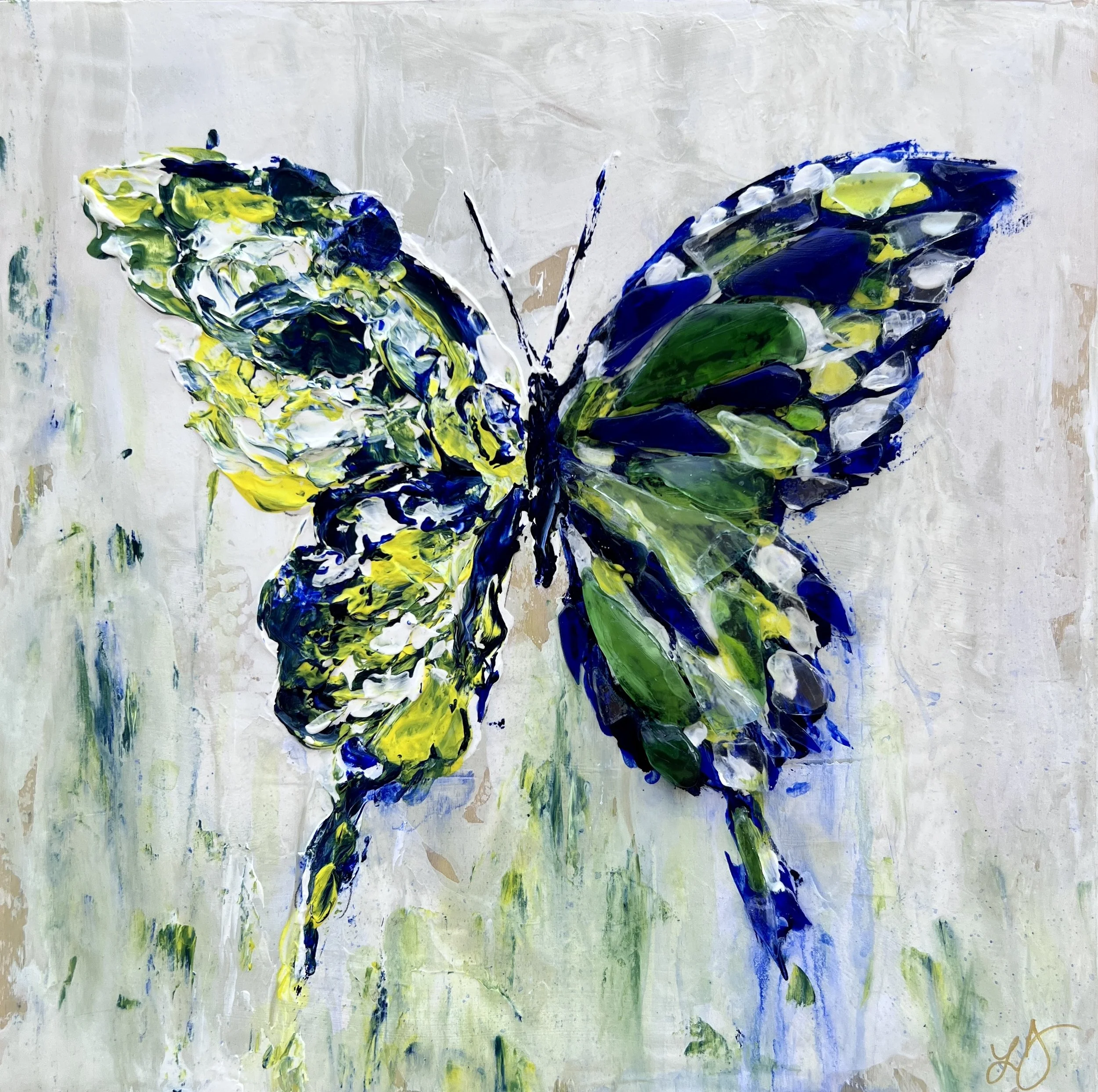 Abstract mixed-media butterfly in bold blues, greens, and yellows, symbolizing transformation and growth with textured energetic strokes.