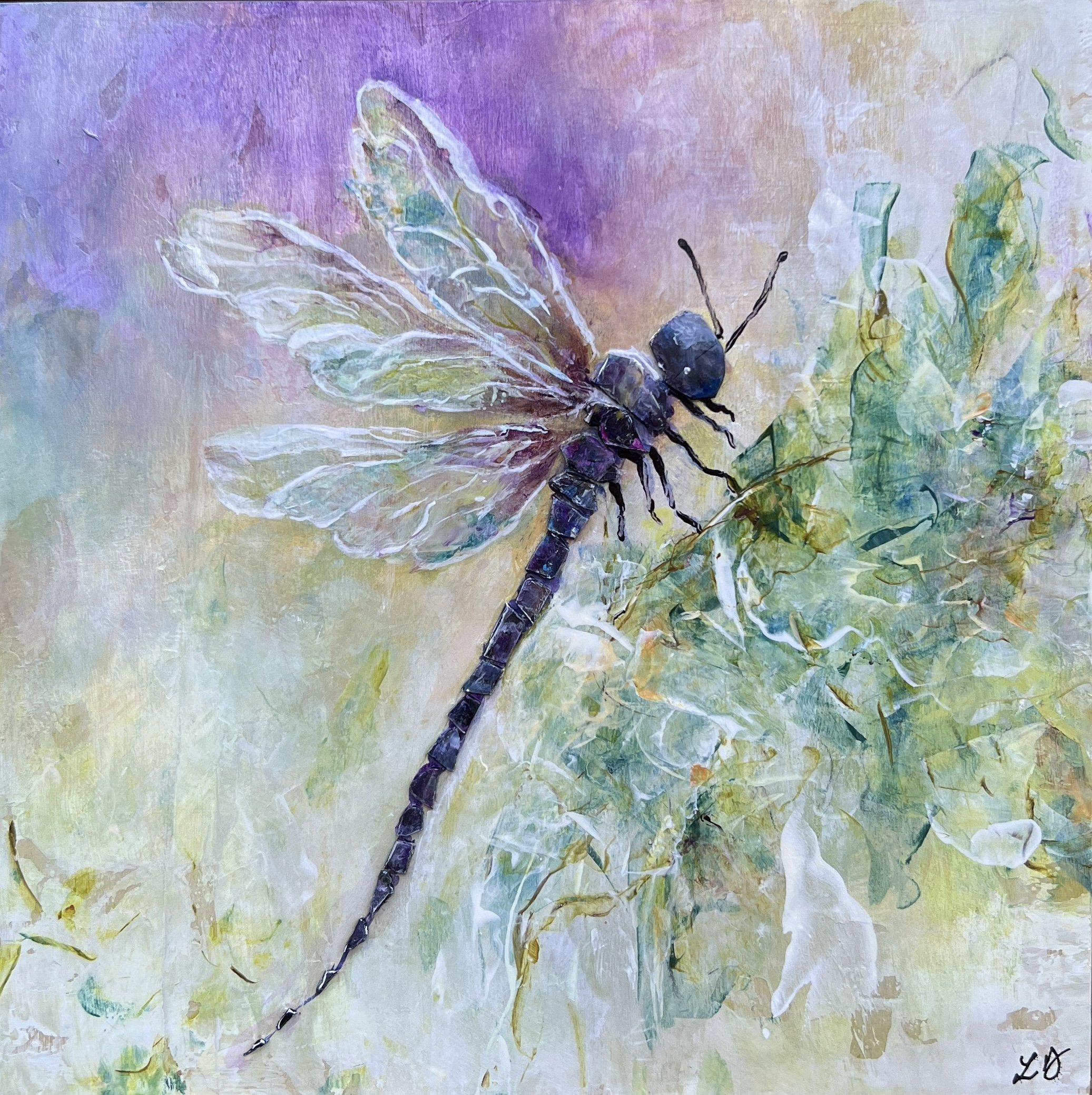 Mixed media dragonfly painting in purples and greens with textured wings and a soft, luminous background, framed in wood.