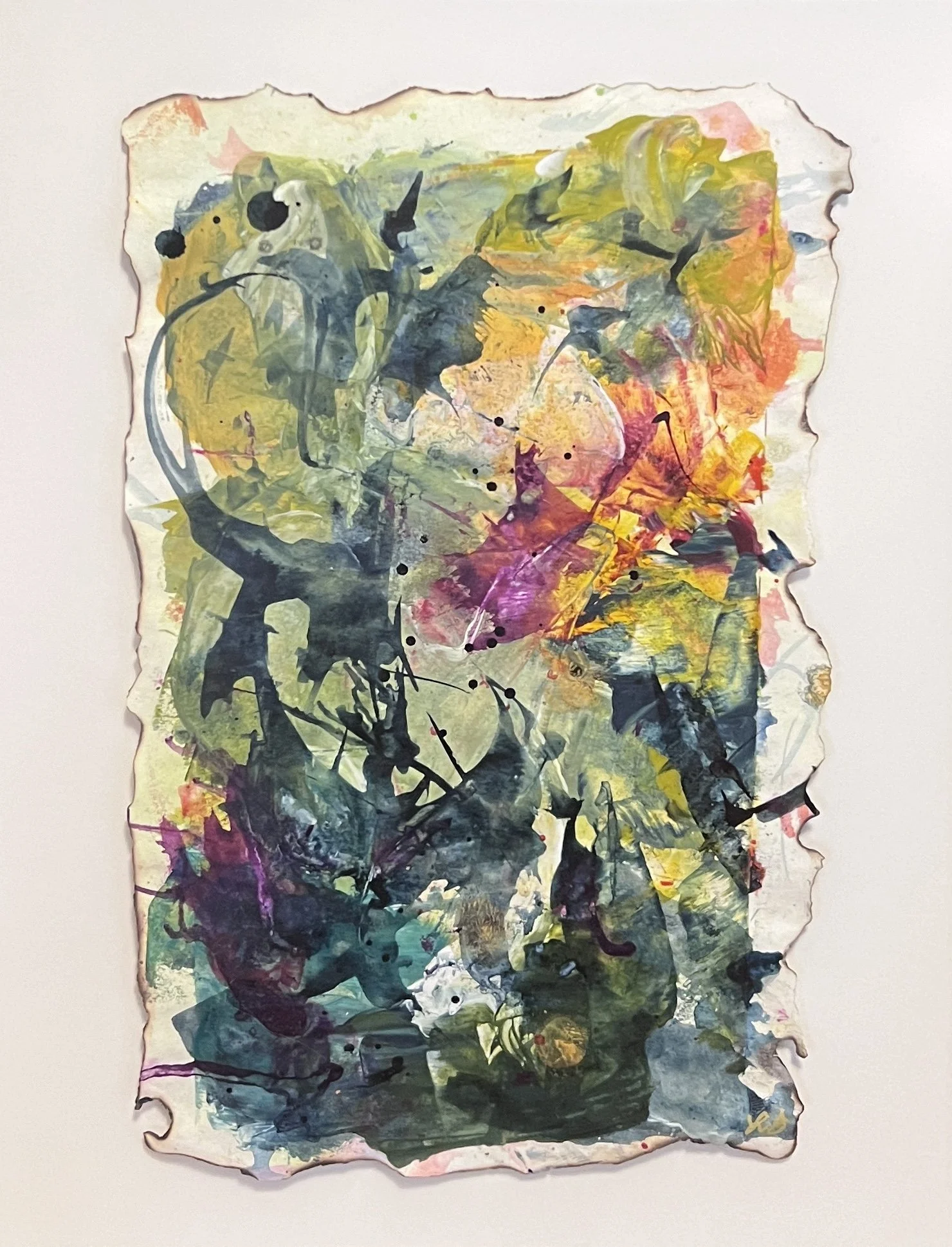 Colorful abstract painting on torn-edge paper with vibrant yellows, pinks, greens, and expressive brushstrokes in a black frame.