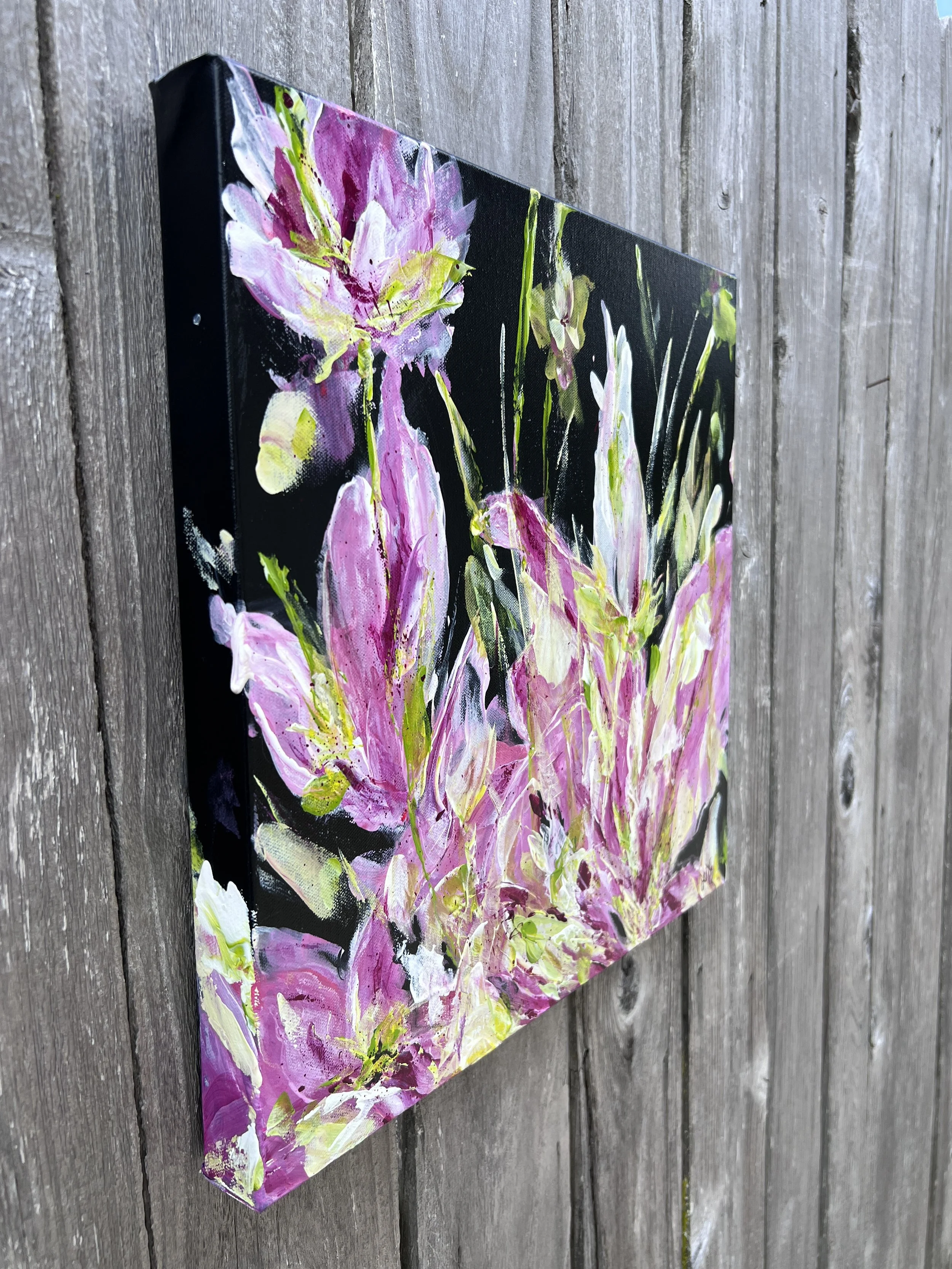 Violet and green abstract floral painting on a black background, shown on a 16×16 gallery-depth canvas.