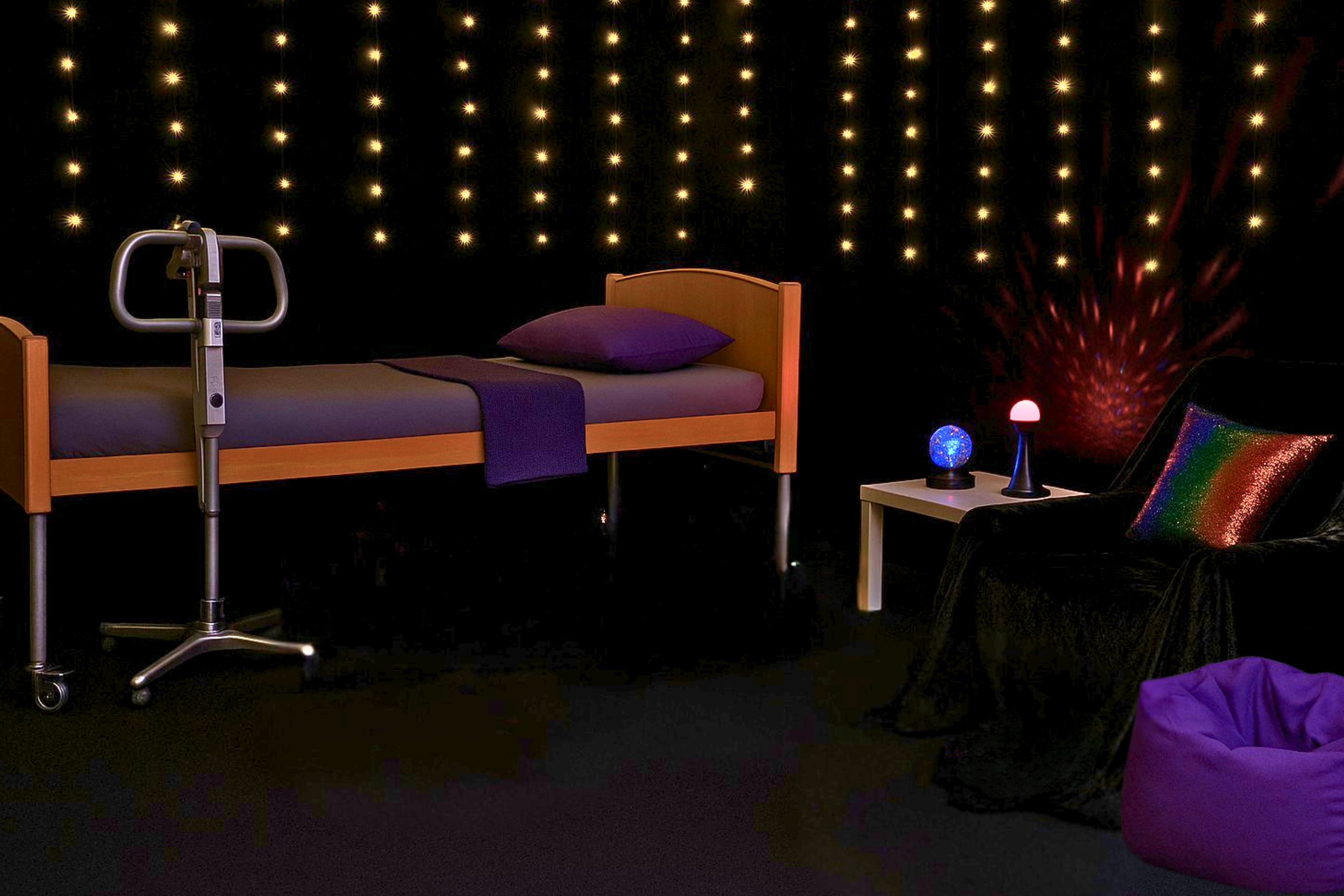 Profile bed and hoist system inside Bass Therapy’s sensory area designed for comfort, safety, and accessibility. It is a low-stimulation sensory zone with fibre-optic lighting and quiet design for regulation and rest.