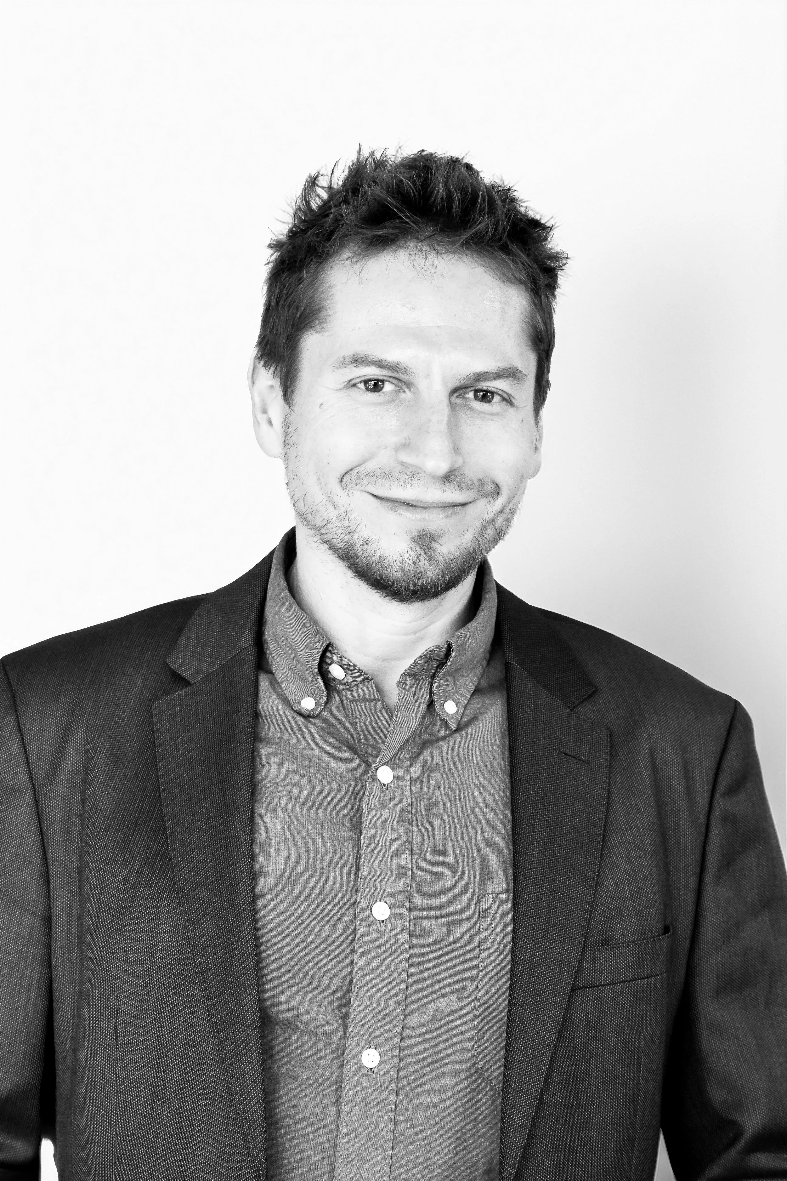 Black and white headshot of Kelvin VP of Sales