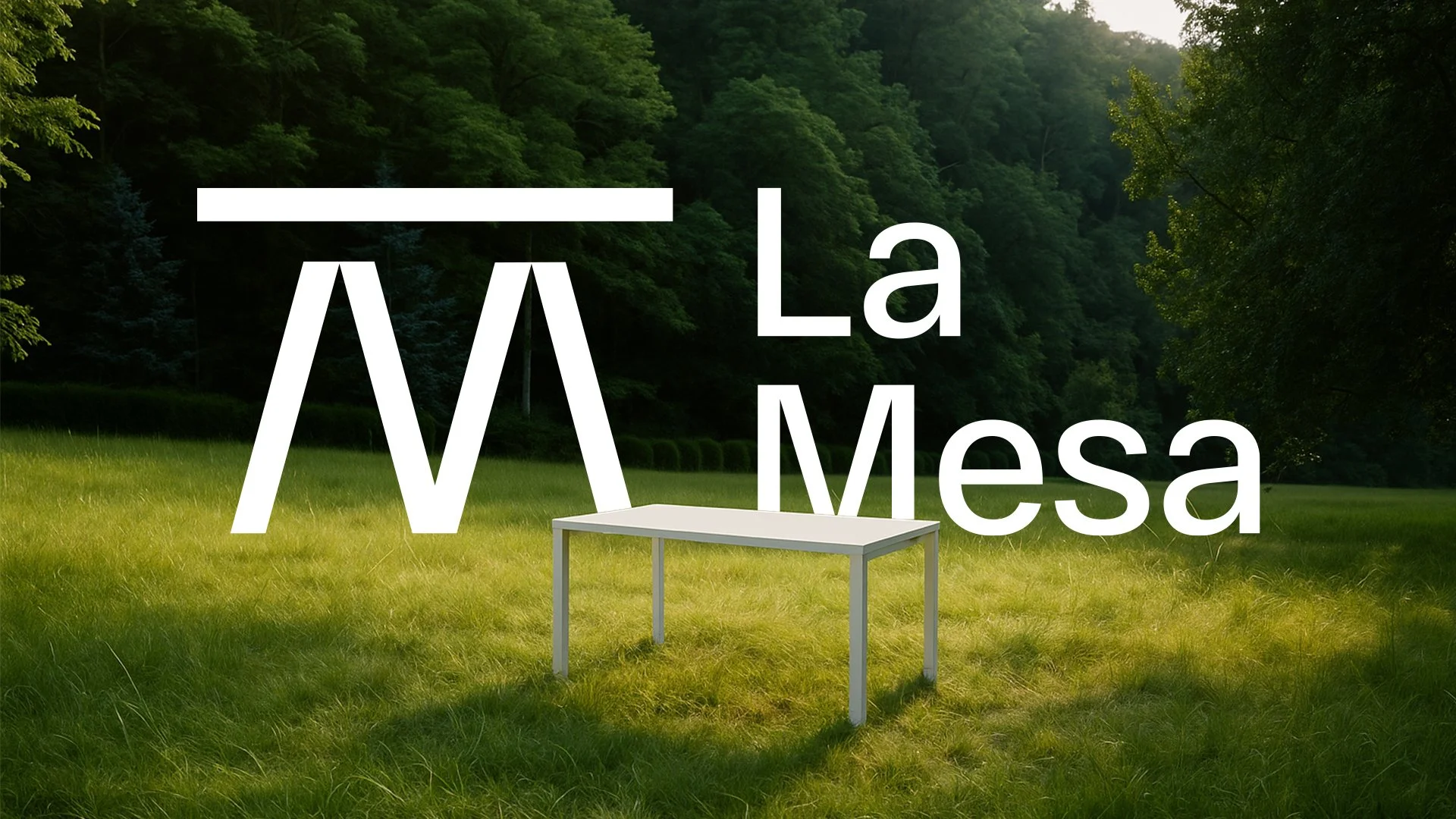 A table in a grassy field with a background of trees, overlaid with the text 'La Mesa' and stylized 'M' logo.