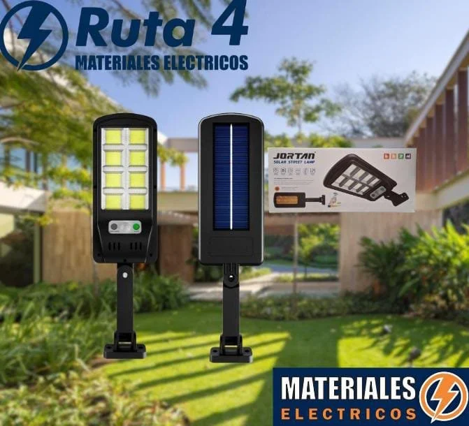 Imagen de un cartel que promociona materiales eléctricos, con componentes solares y luminarias solares en un jardín.