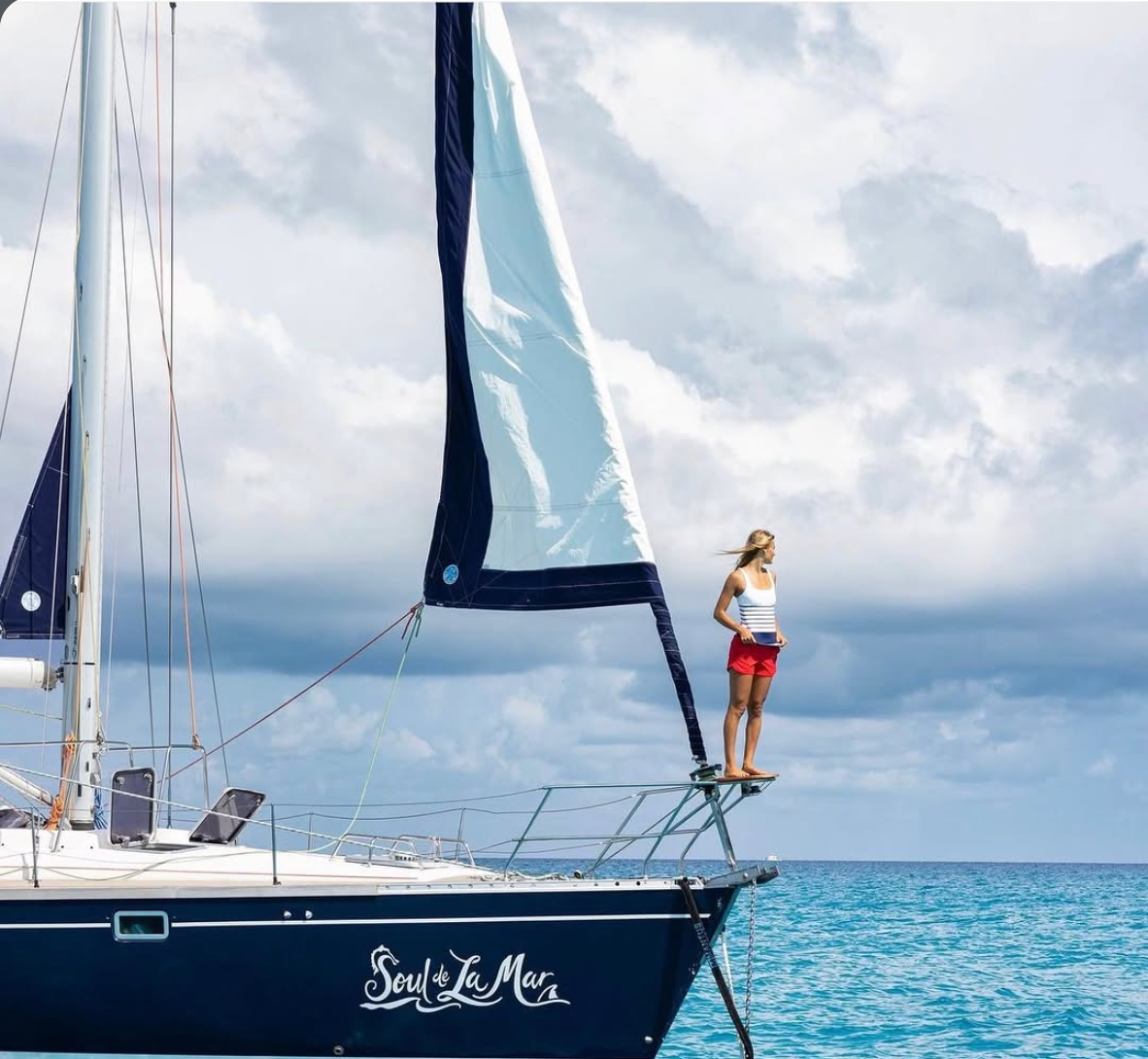 Lauren Landers on the bow of S/V Soul de La Mar