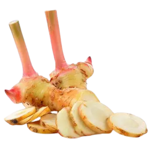 Sliced ginger root and two ginger stalks.