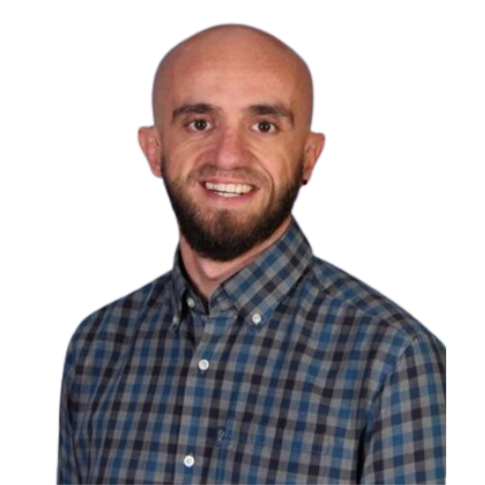 Airbnb Property Management Director - Adam Millington - A man with a beard and bald head smiling, wearing a blue and gray checkered button-up shirt.