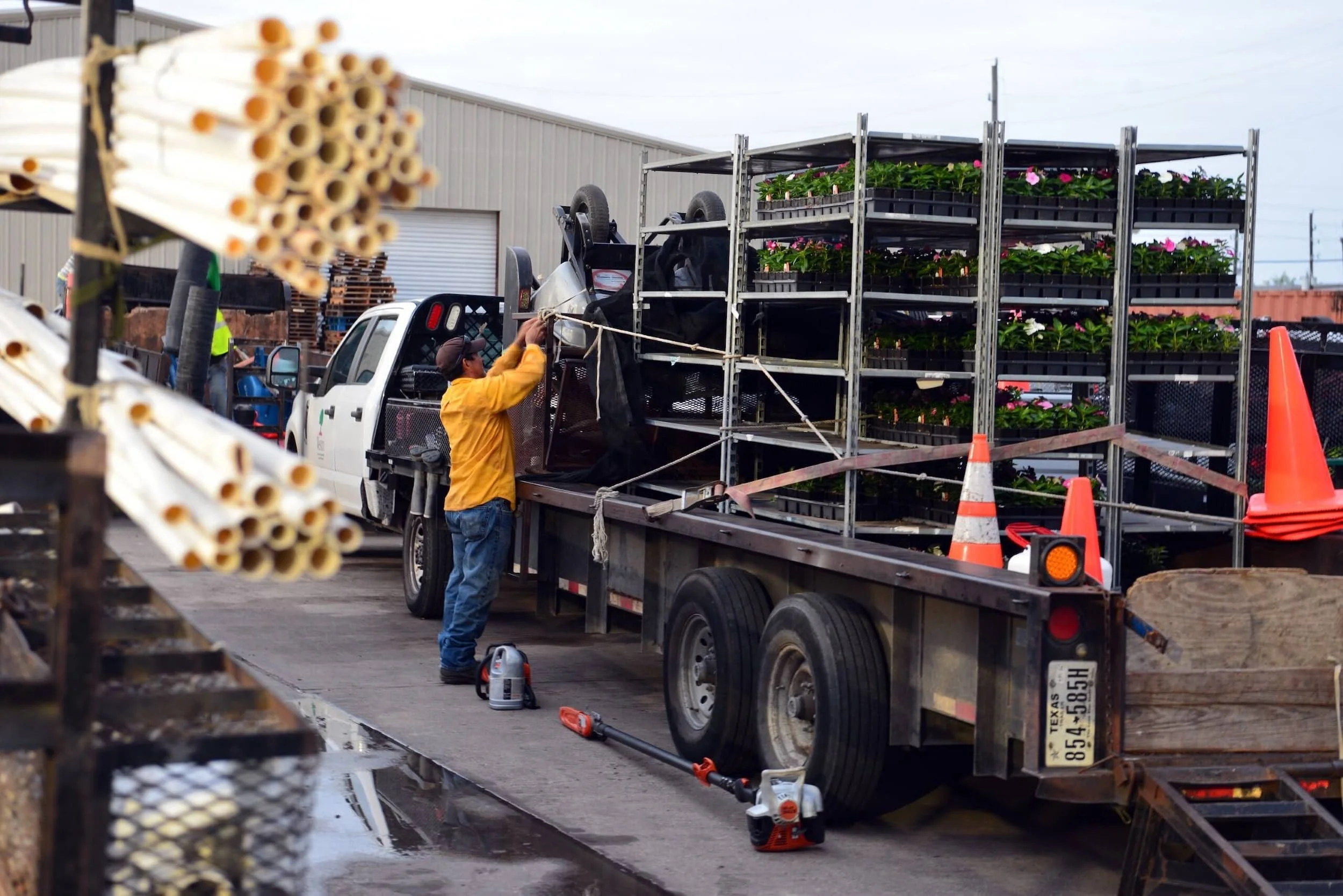 Commercial landscaping crew loading materials in Houston, TX