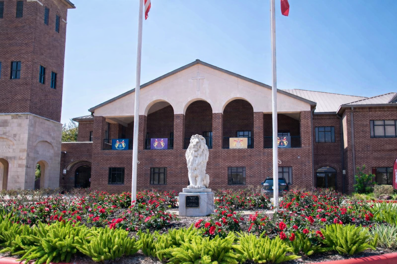 Higher education campus grounds with trimmed hedges and lawn maintenance in Montgomery County, TX