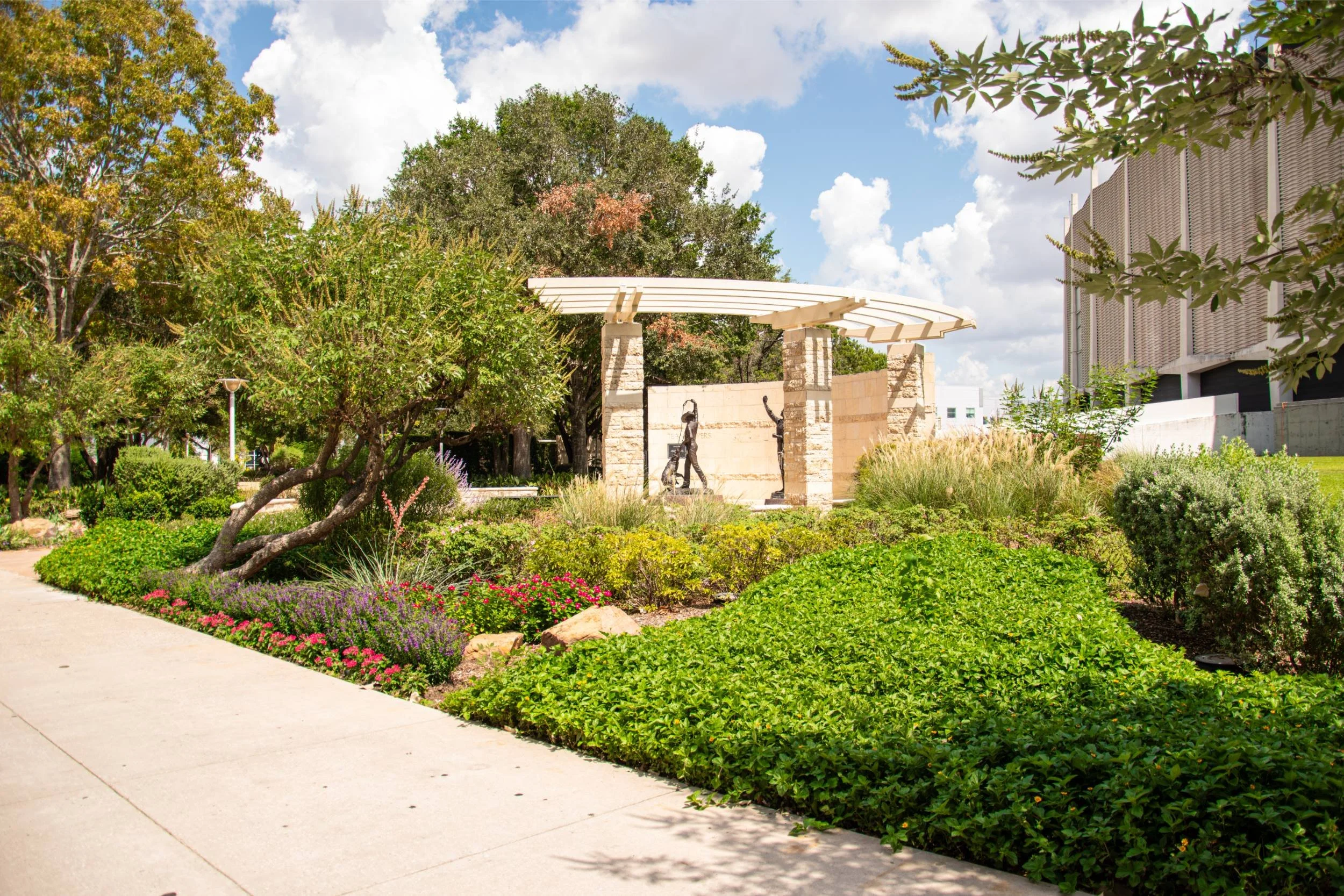 A landscaped garden with lush greenery after commercial lawn care Harris County, TX