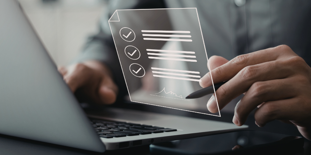 Professional reviewing a digital presence checklist on a laptop, representing a website and online brand credibility audit