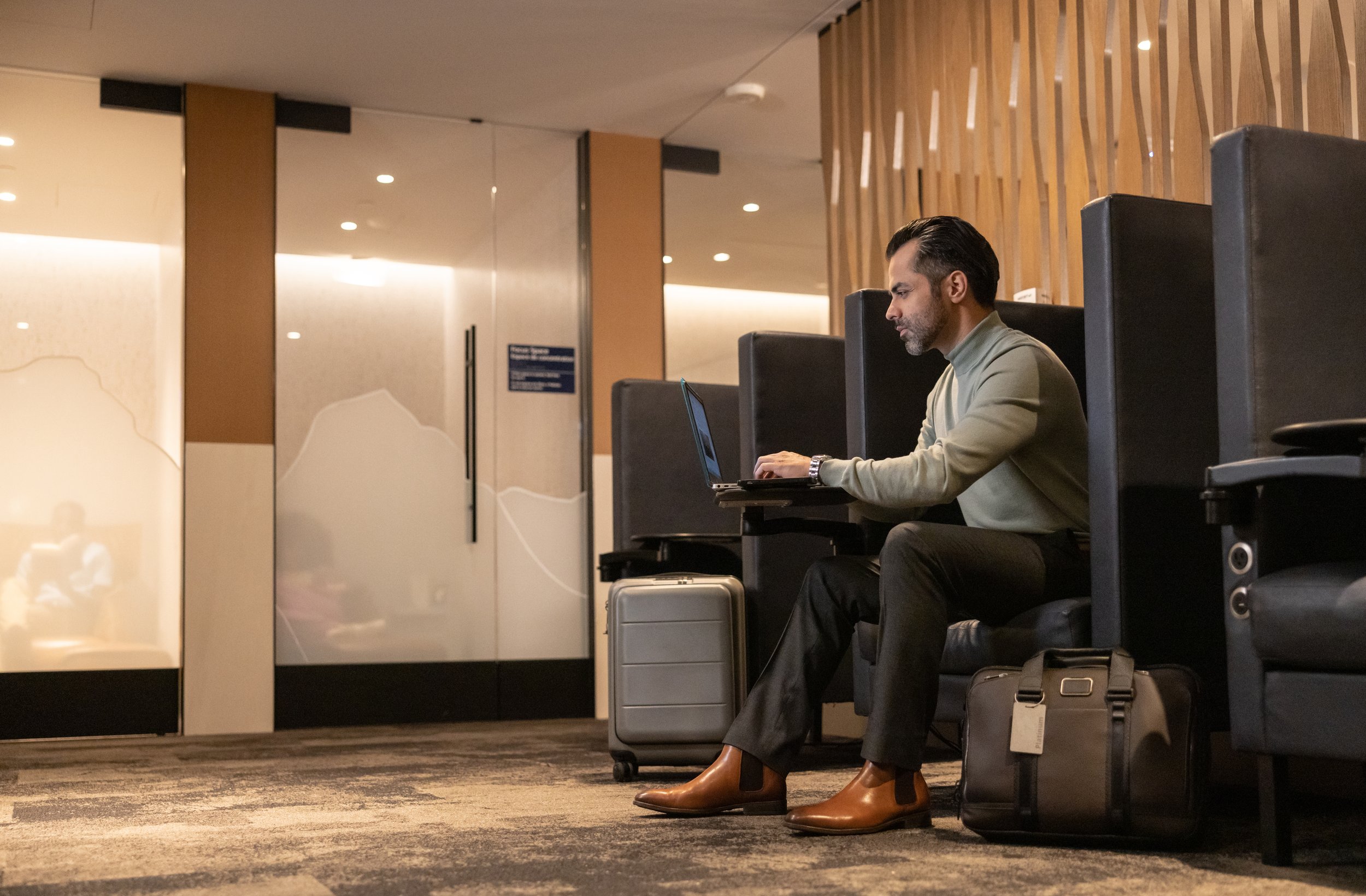 WJ-NH-Elevation-Lounge-ManOnLaptop.jpg