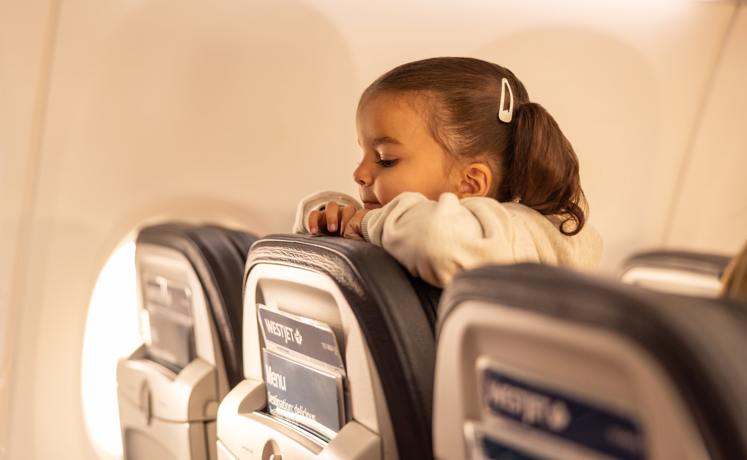 WJ-737-NH-ToddlerLooksOverSeat.jpg