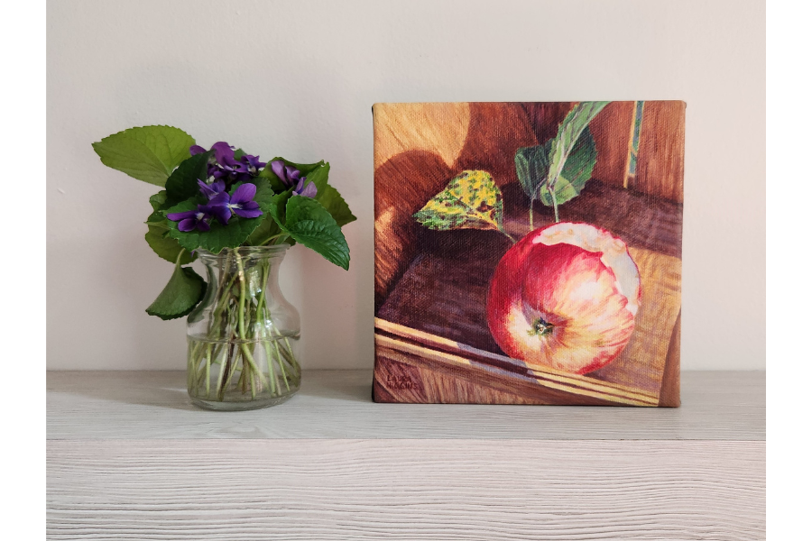 apple-with-bite-painting-higgins-on-shelf-2.png