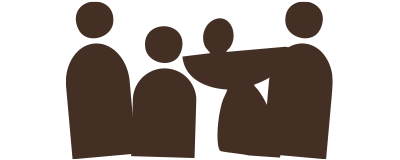 Silhouette of three people standing, one appears to be pushing or pointing at another.