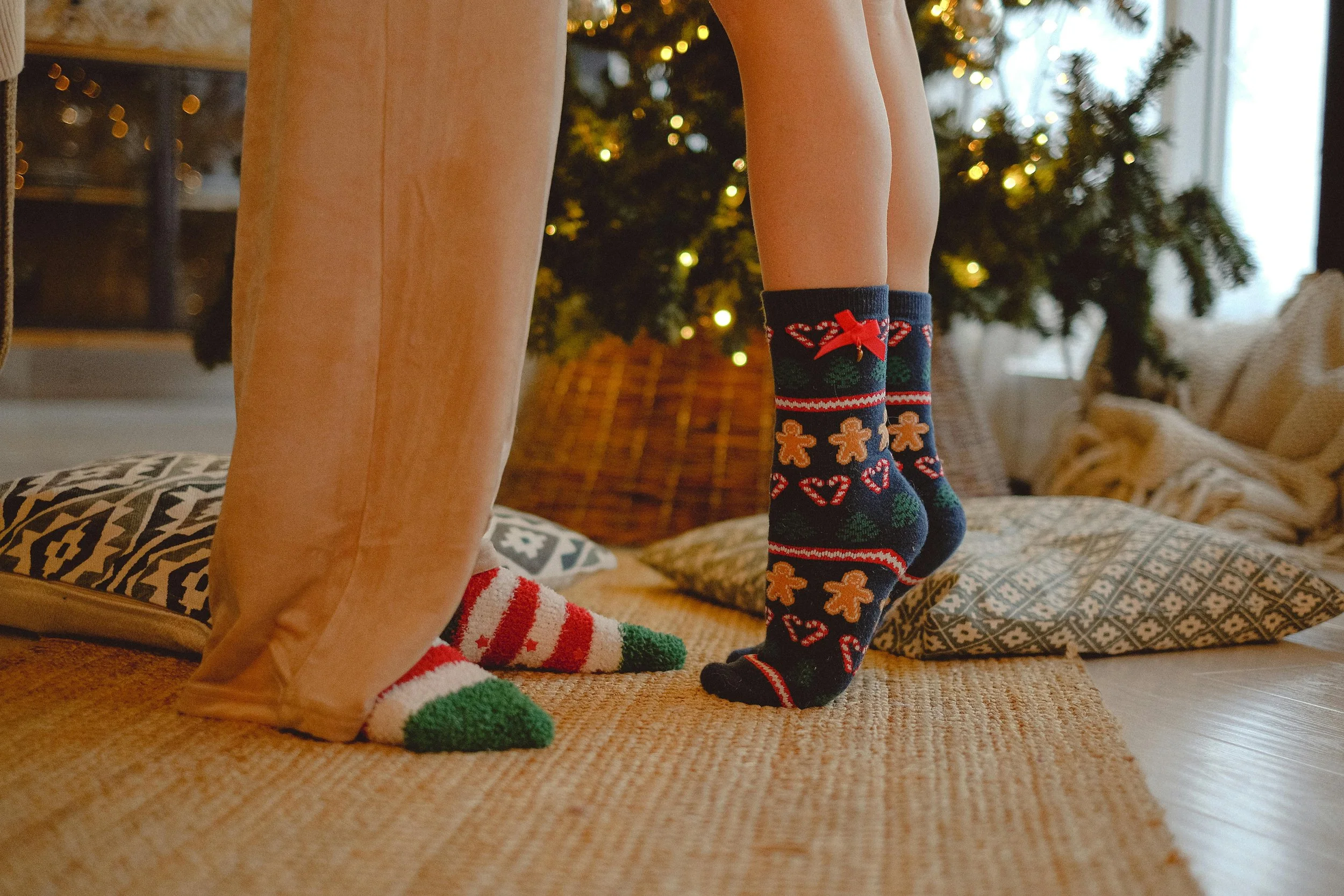 Custom holiday-themed socks manufactured with original designs for a clothing brand.