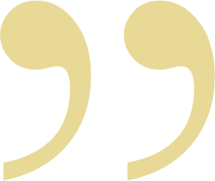 Close-up of light gold close quotation marks on a white background.