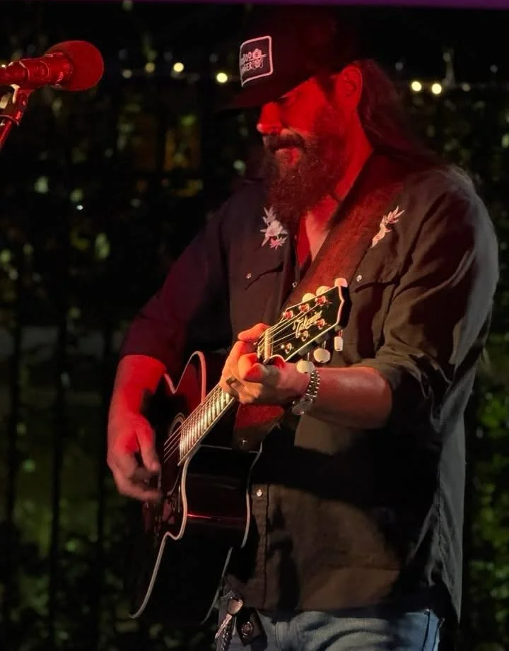 Sonny Reece at a show playing his guitar