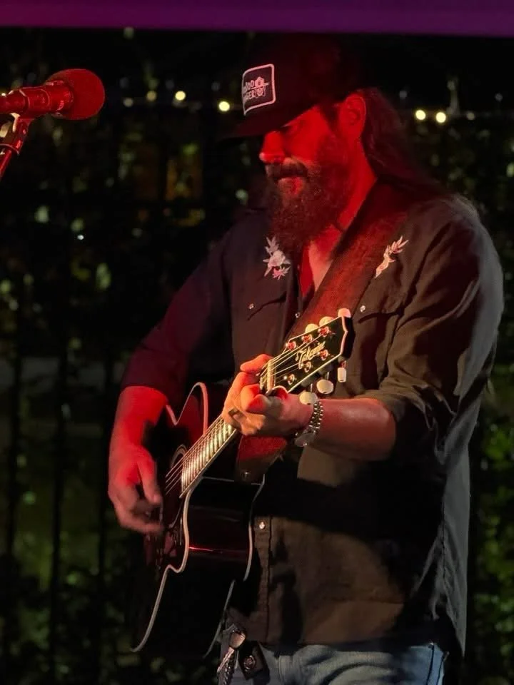 Sonny Reece at a show playing his guitar