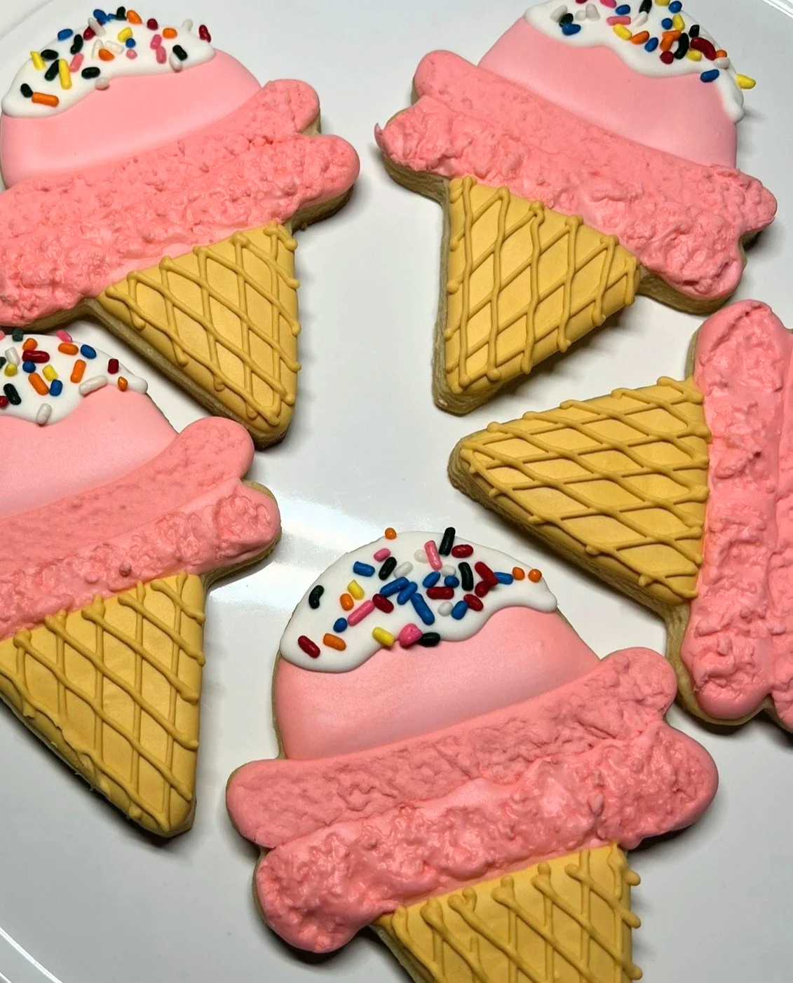 Sugar cookie decorated as an ice cream cone. Links to cookie menu.