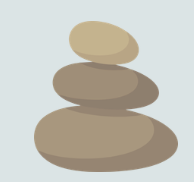 Stacked stones in nature symbolizing stress management.
