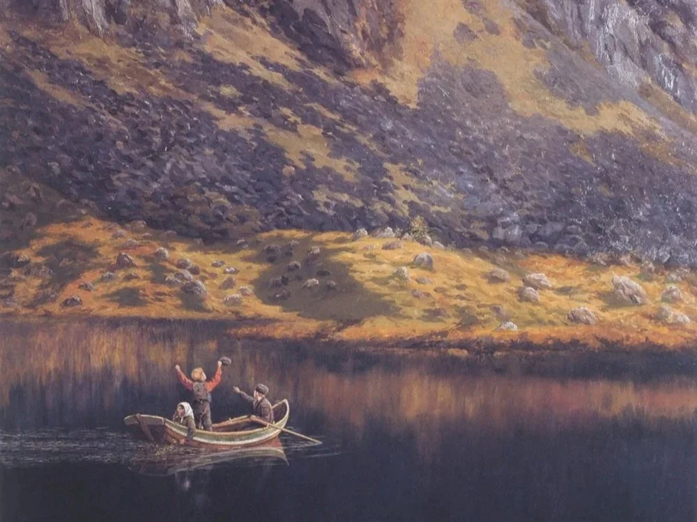 Scenic landscape with mountains, a lake, and rolling grassy hills, under an overcast sky.