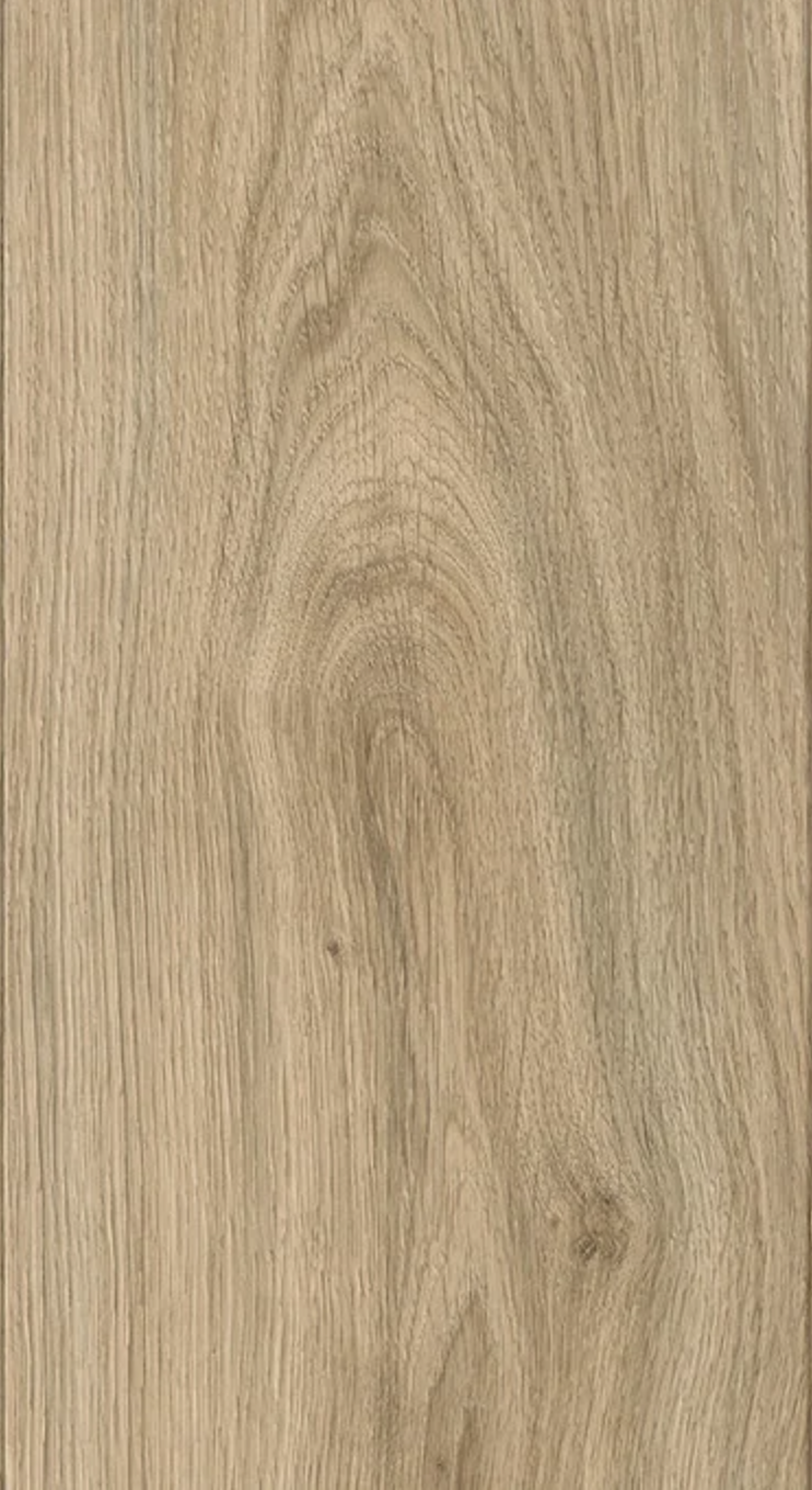 Close-up of a wooden surface with visible grain patterns and knots.