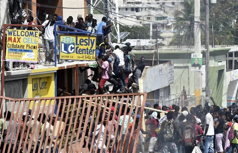 Haiti protests escalate as streets barricaded, police cars set on fire