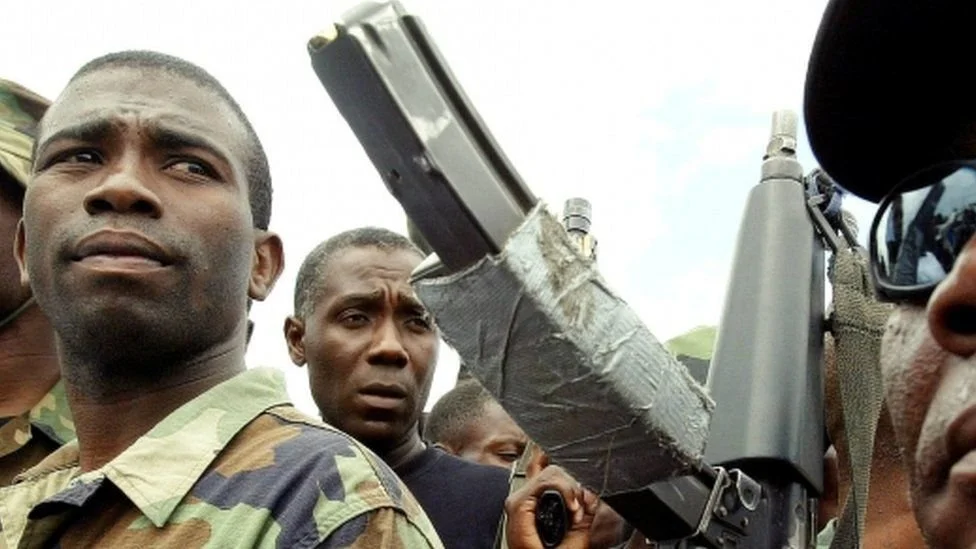 Former rebel leader arrives in Haiti's capital as protests against prime minister gain momentum