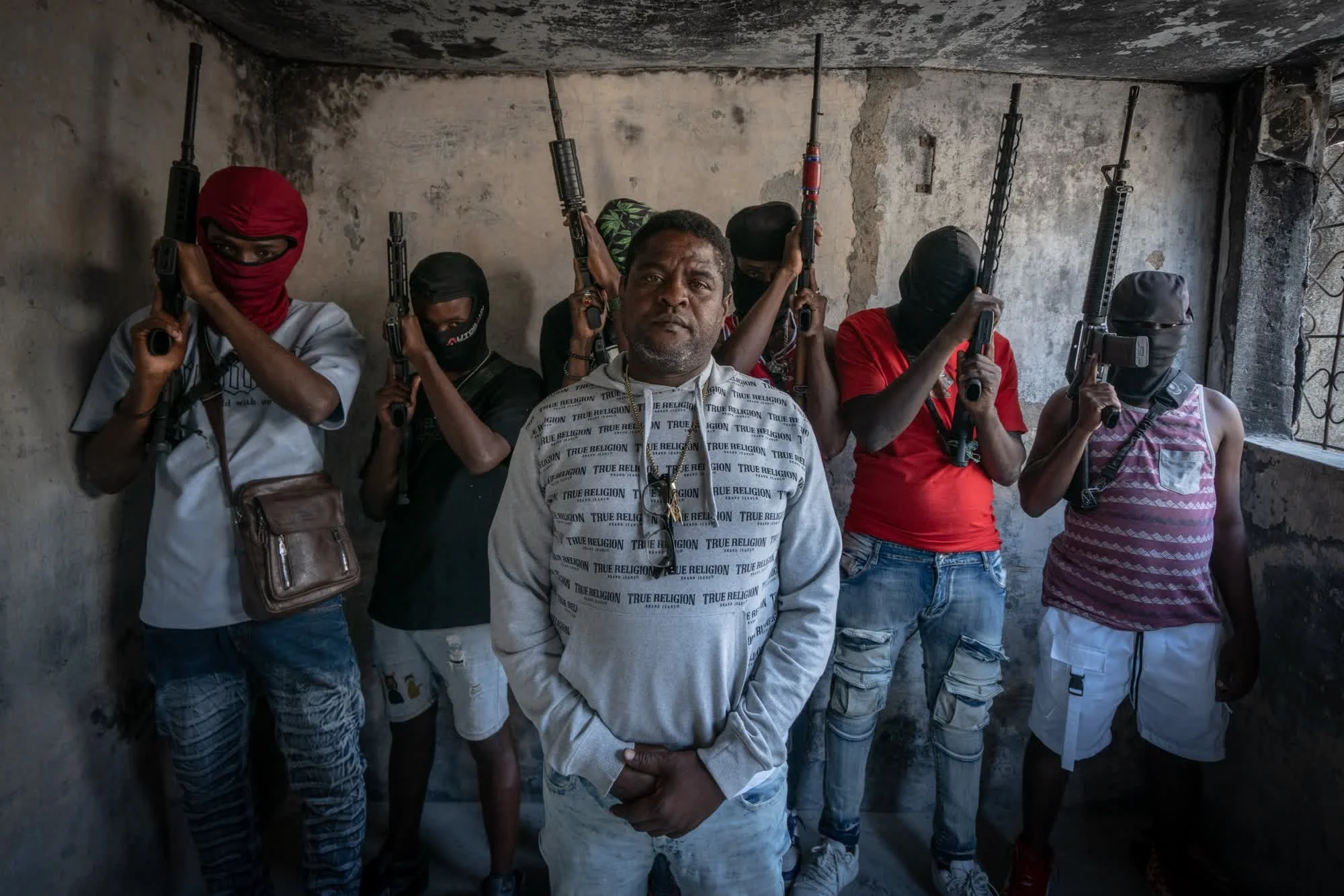 In a city cut off from the world, guns and drugs keep flowing