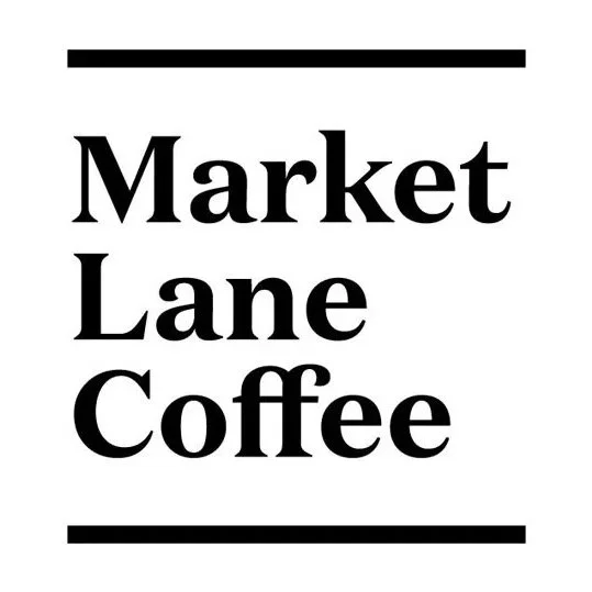 Text that says 'Market Lane Coffee' with black lines above and below, on a white background.