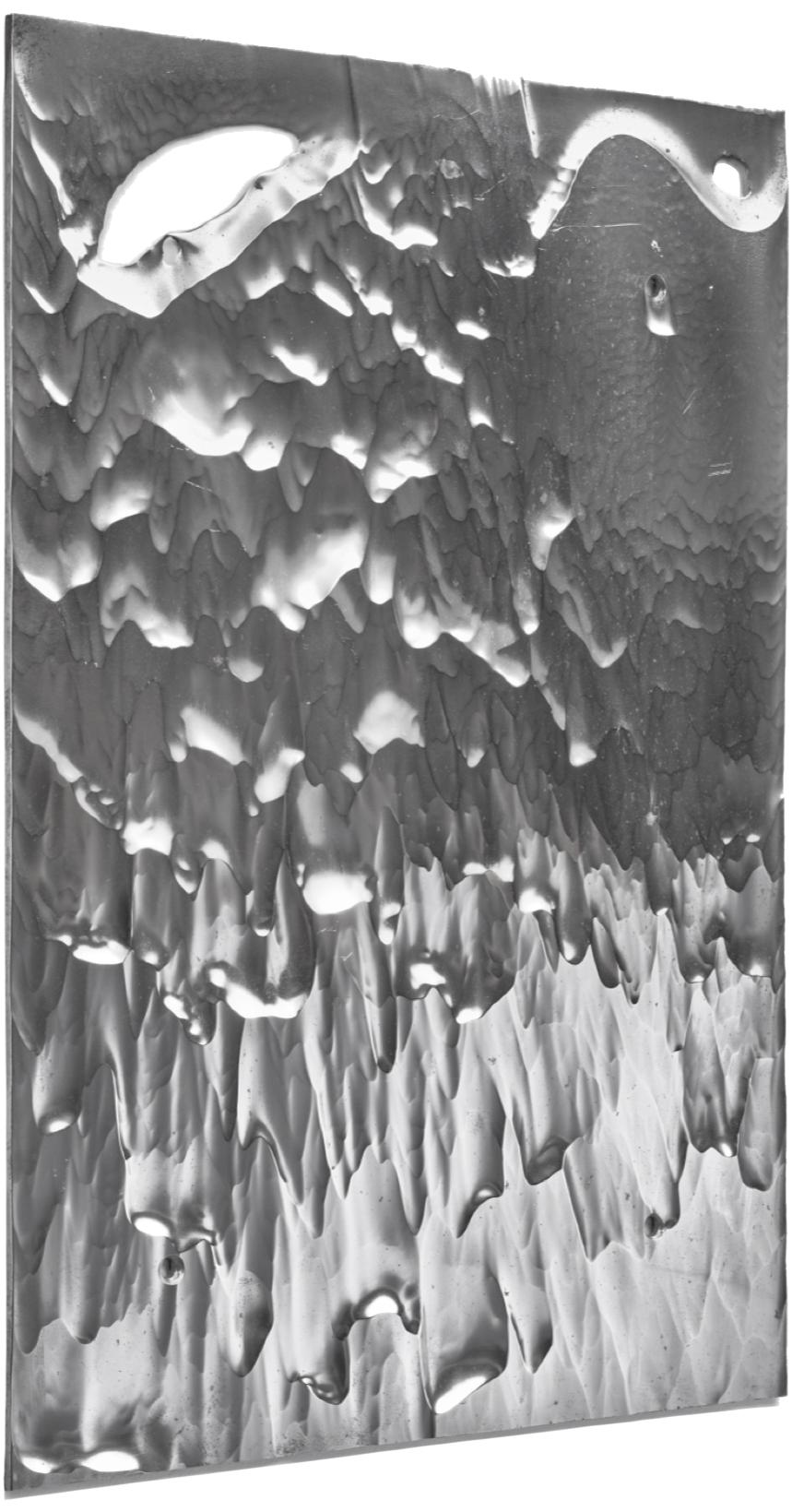 Close-up view of a surface with textured, irregular, layered formations and some small holes, possibly glacier ice or mineral deposit.