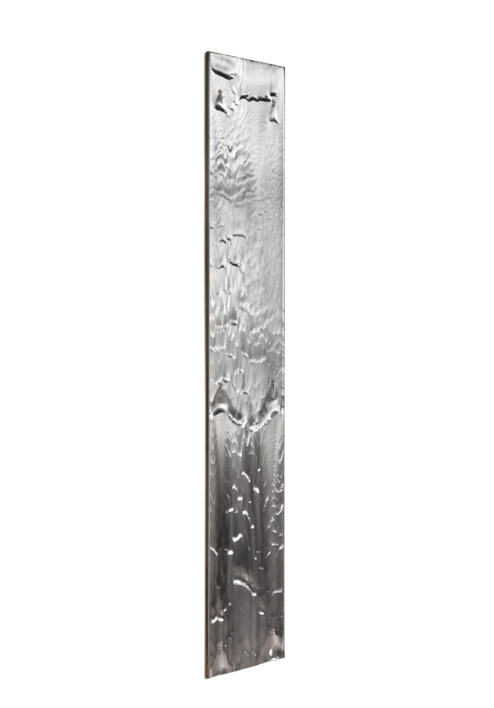 A vertical silver-colored metallic monument with a textured surface resembling rippling water, set against a black background.