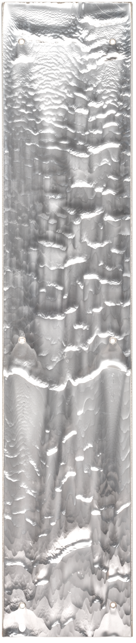 A metallic, textured surface with a series of uneven, wavy ridges and ripples, and four small holes.