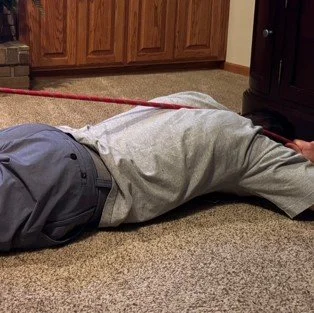 A fun rehab exercise I call the "hog tie tug."