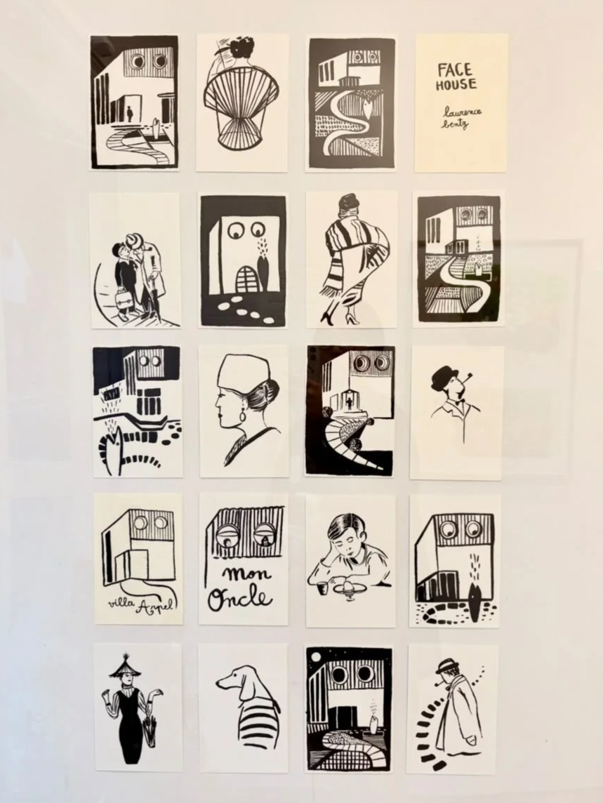 A collection of 20 black and white illustrations and notes arranged on a wall, featuring people, abstract designs, and cityscapes, with one note titled 'FACE HOUSE' and handwritten names, including 'Lemaree Benty' and 'villa Angel'.