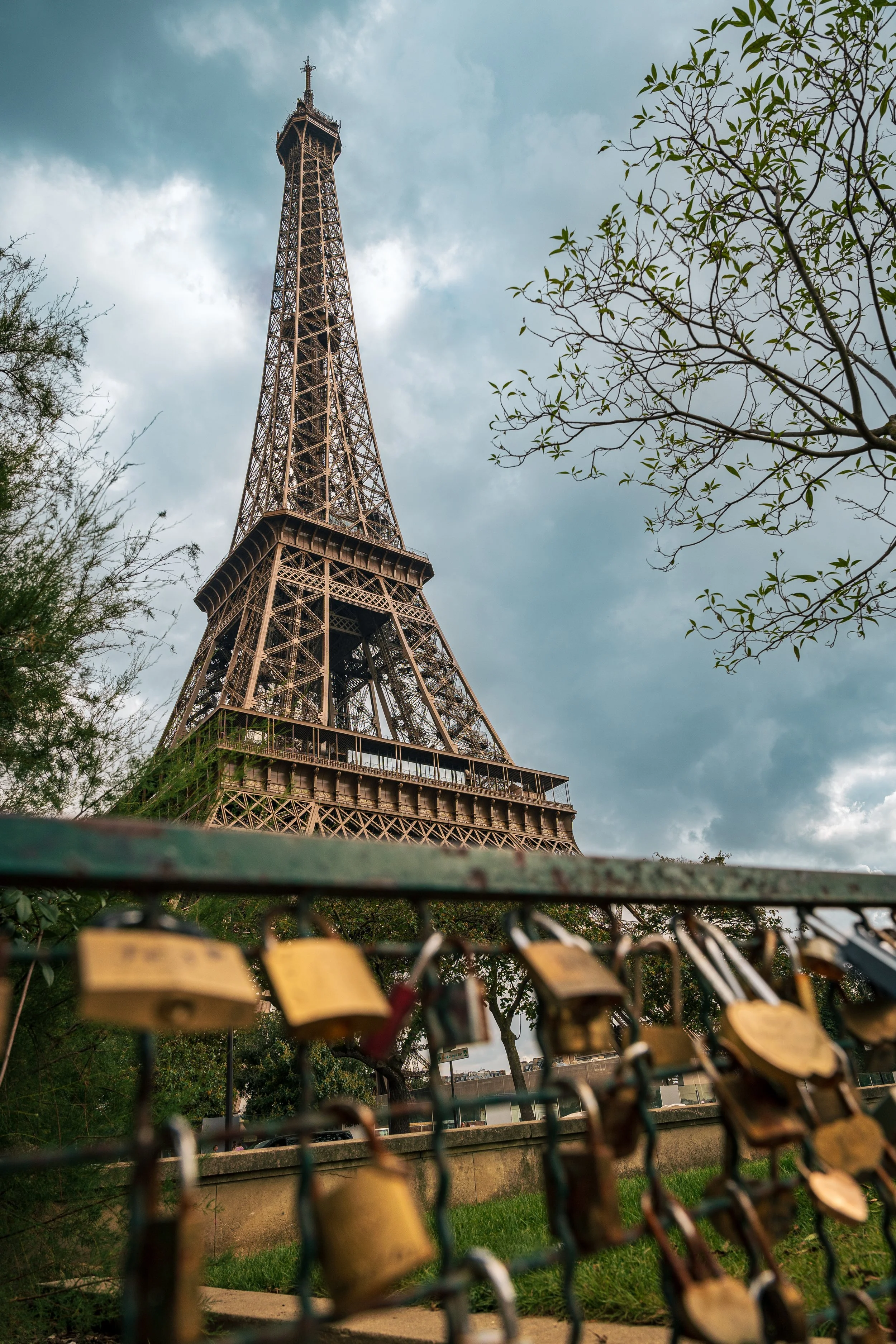 The Eiffel Tour and a gate with love locks on them. Paris, France, 2023.