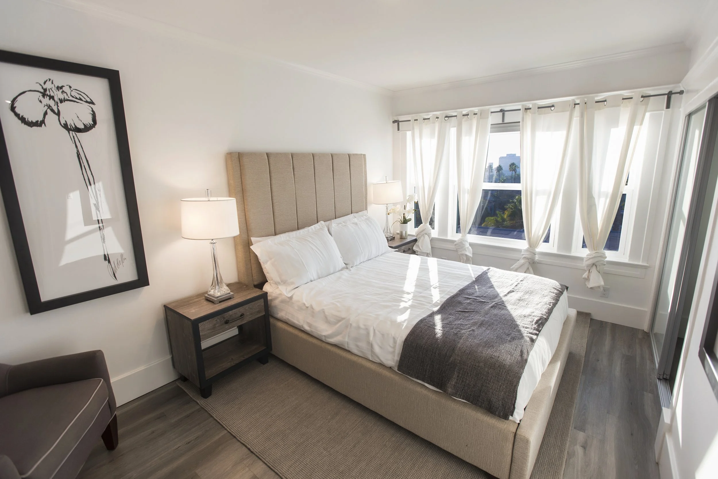 Master bedroom with windows and ample natural light