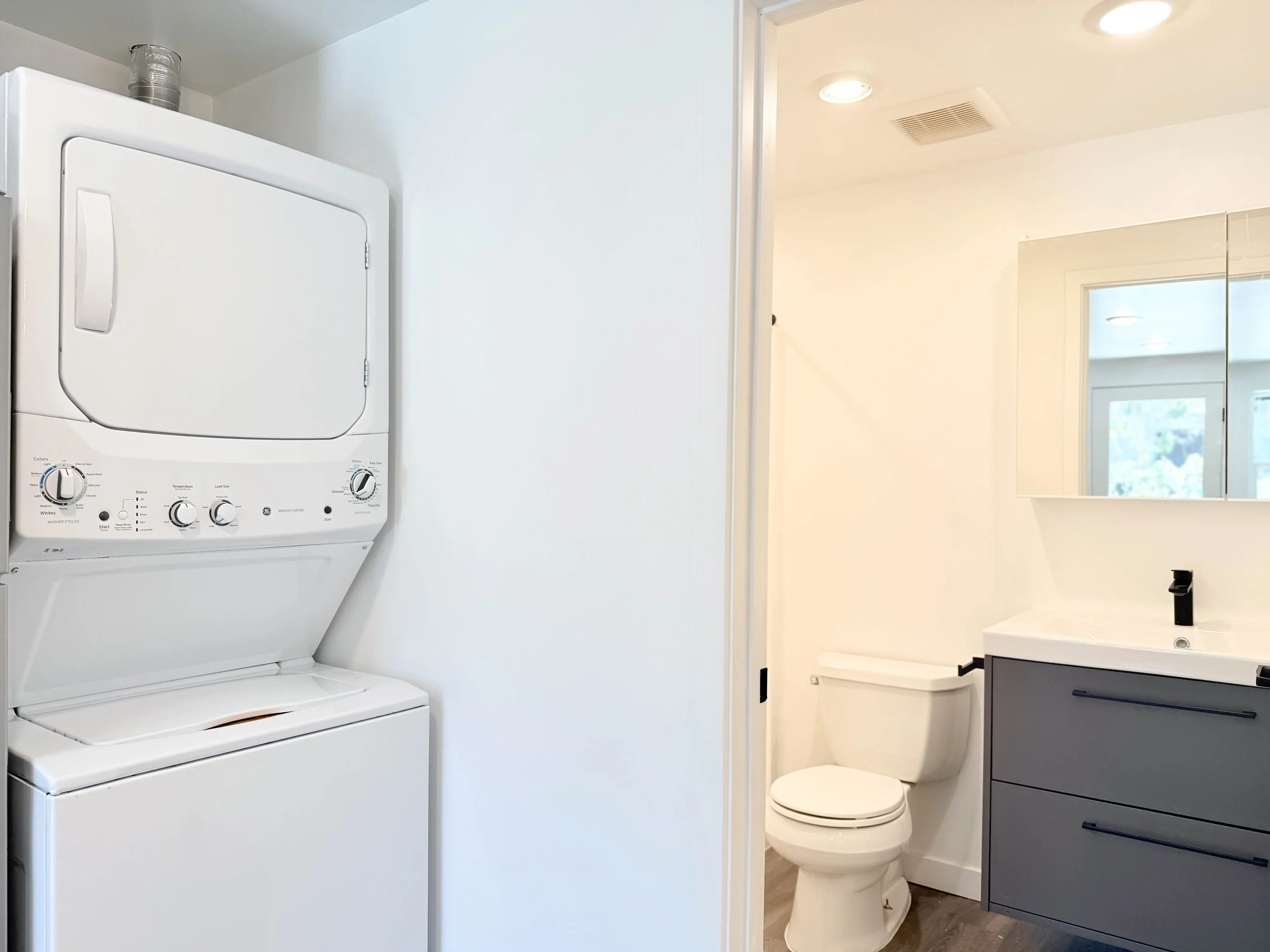 Floor plan of a small apartment including a living room, kitchen area, bedroom, and bathroom with shower.