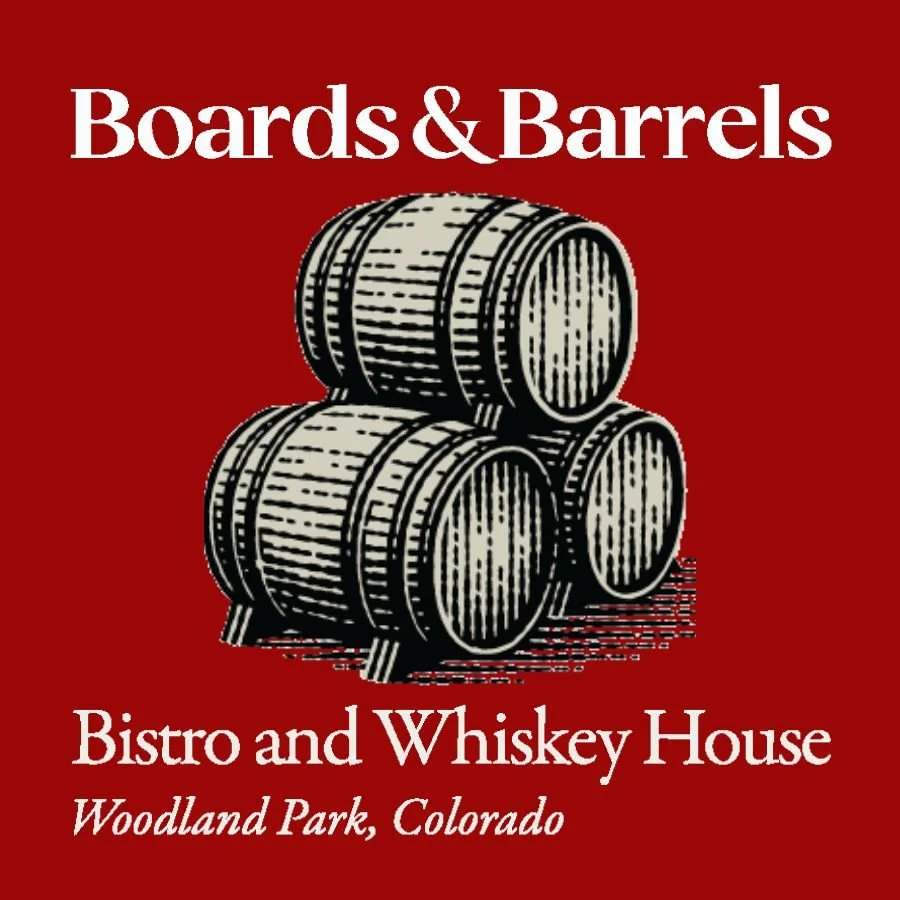 Logo for Boards & Barrels Bistro and Whiskey House in Woodland Park, Colorado, featuring three wooden barrels on a red background.