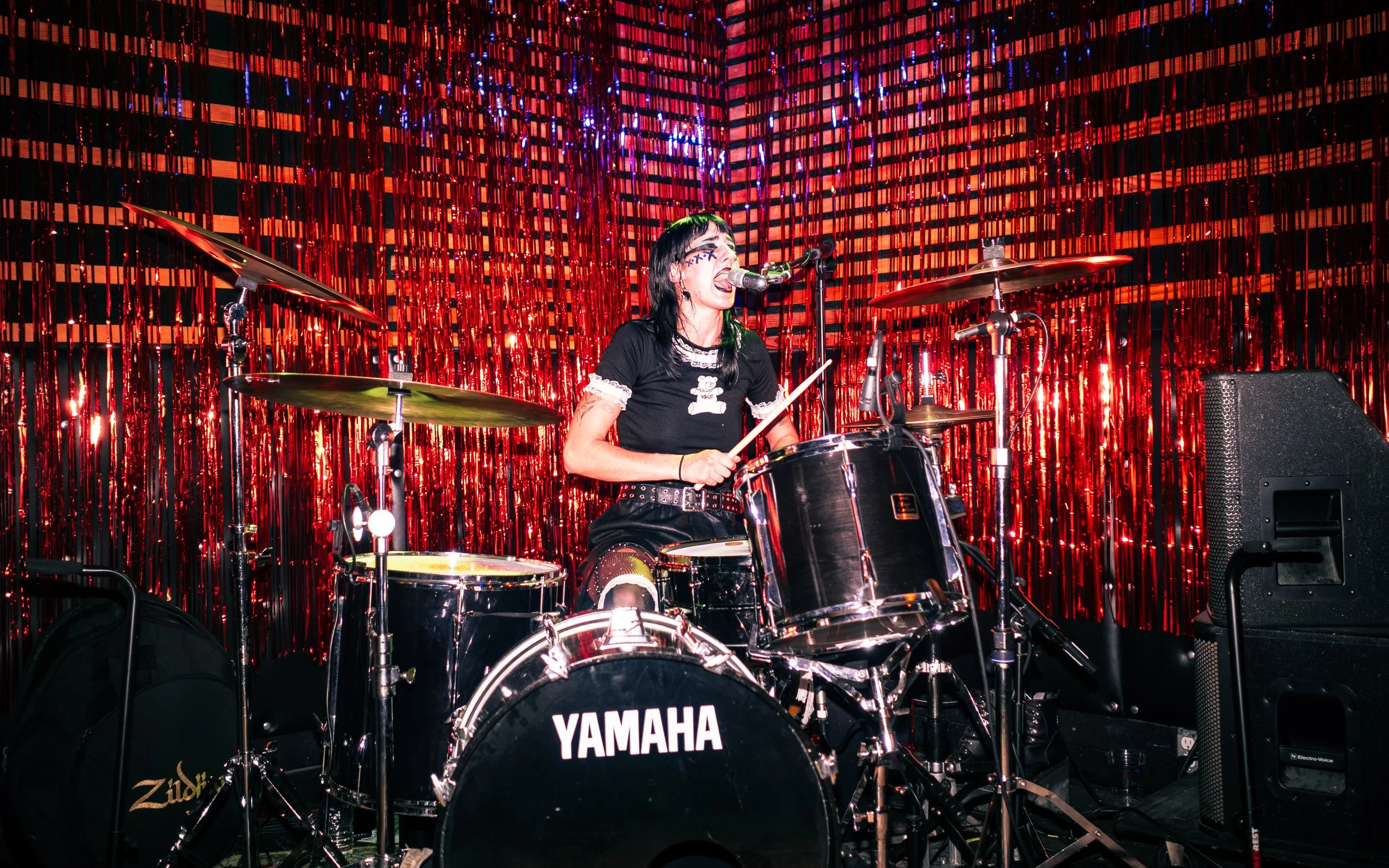 Baylee Harper of Zookraught is playing drums and singing while performing at the Sunset Tavern in Seattle, WA. 