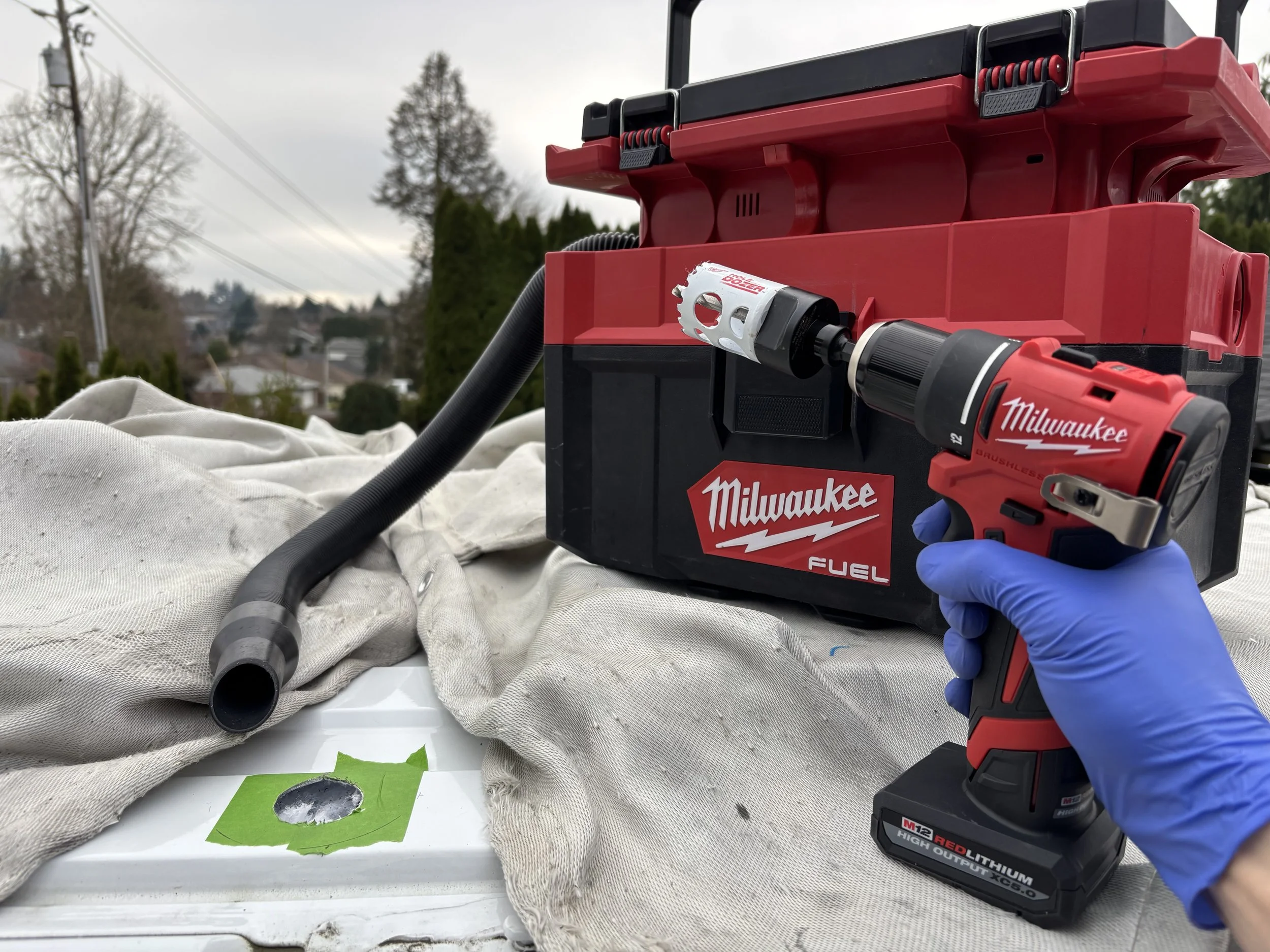 Professional installation of a solar entry gland on the roof of a cargo van conversion build into a camper van.