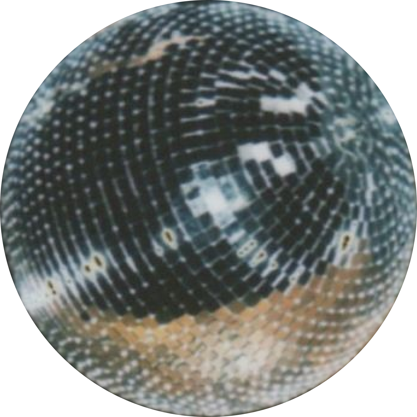 Close-up of a mirror ball with a reflective, dotted surface.