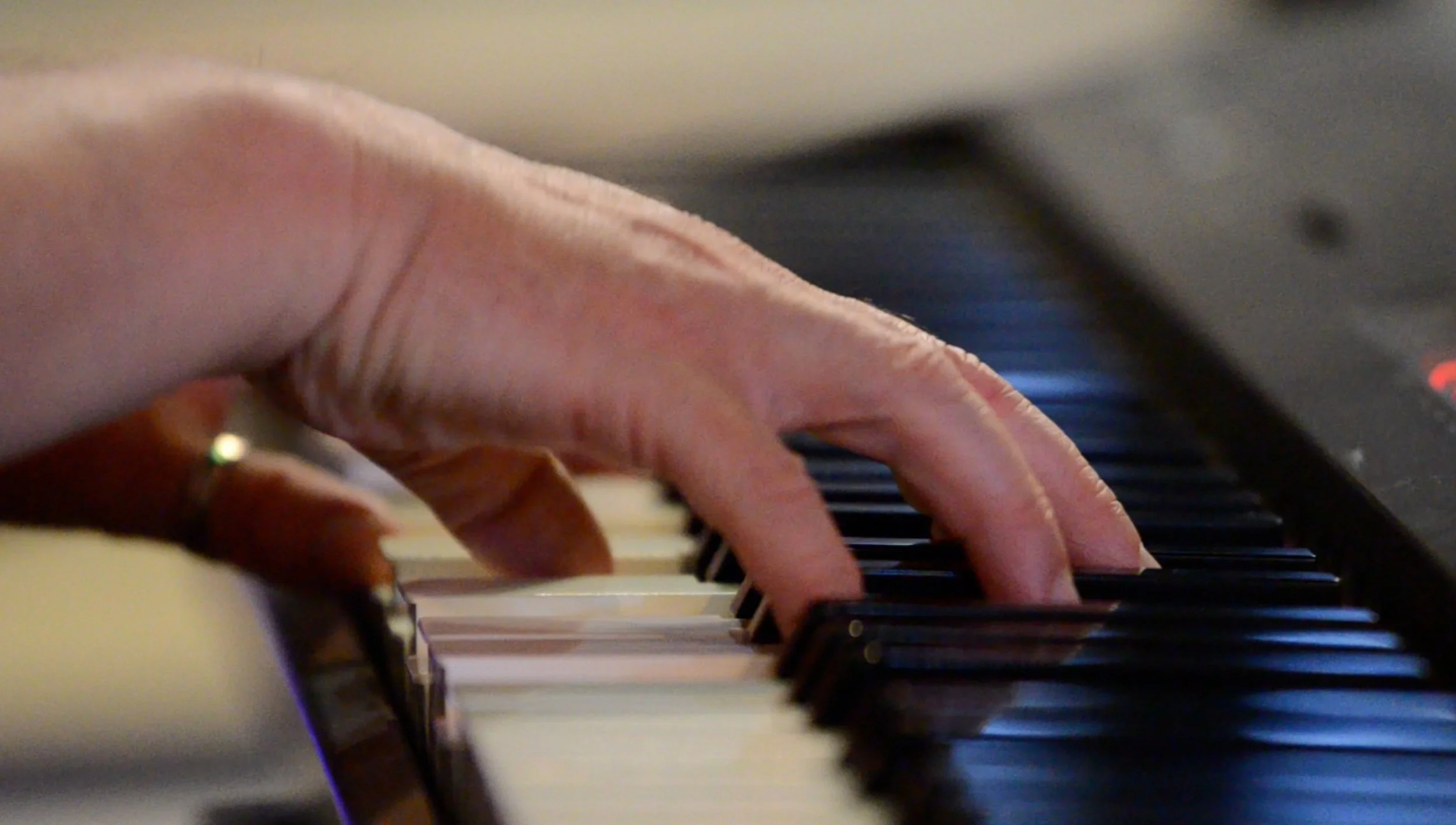 Pianist playing piano at a live music event