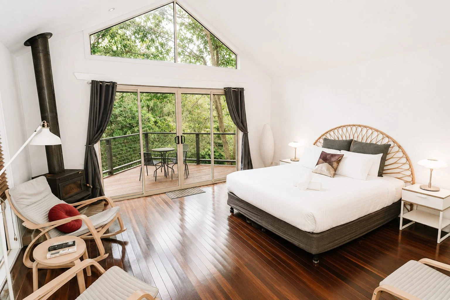 A Shambala Estate cottage with a bright bedroom and private balcony overlooking the gardens.