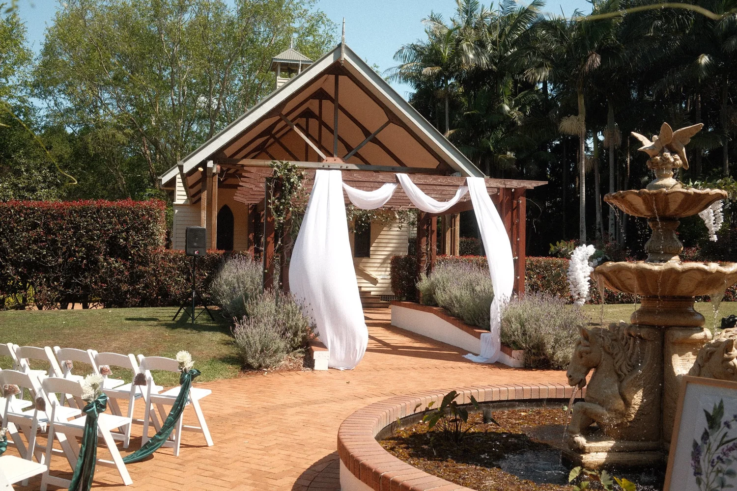 An intimate garden wedding ceremony at Shambala Estate on Tamborine Mountain.